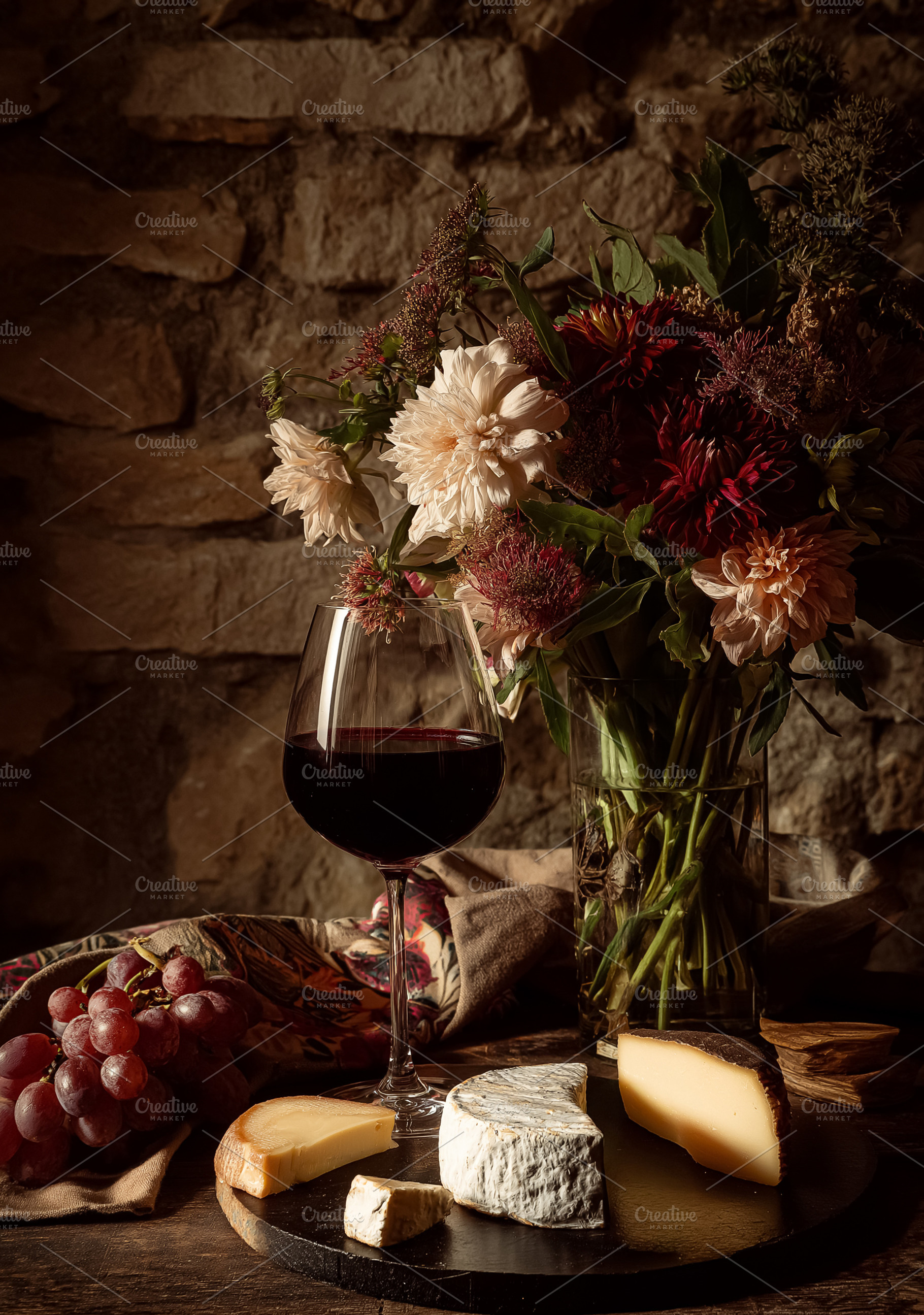 Red wine and cheese tasting with a floral arrangement, enjoying a rustic evenin, a Food & Drink Photo by Studio ANNA