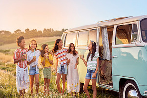 Children laughing beside vintage camper van, a Person Photo by DanFLCreativo