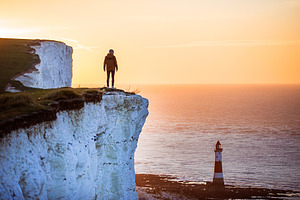 The lighthouse containing seven sisters, golden hour, and man