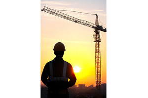 Silhouette of construction worker at, an Industrial Photo by Lermont51