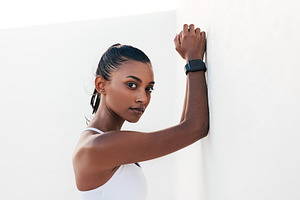 Slim athlete leaning white wall, a Sports & Recreation Photo by Artem Varnitsin