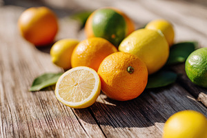 Ripe orange fruit on wooden table, a Food & Drink Photo by AlyaAnd