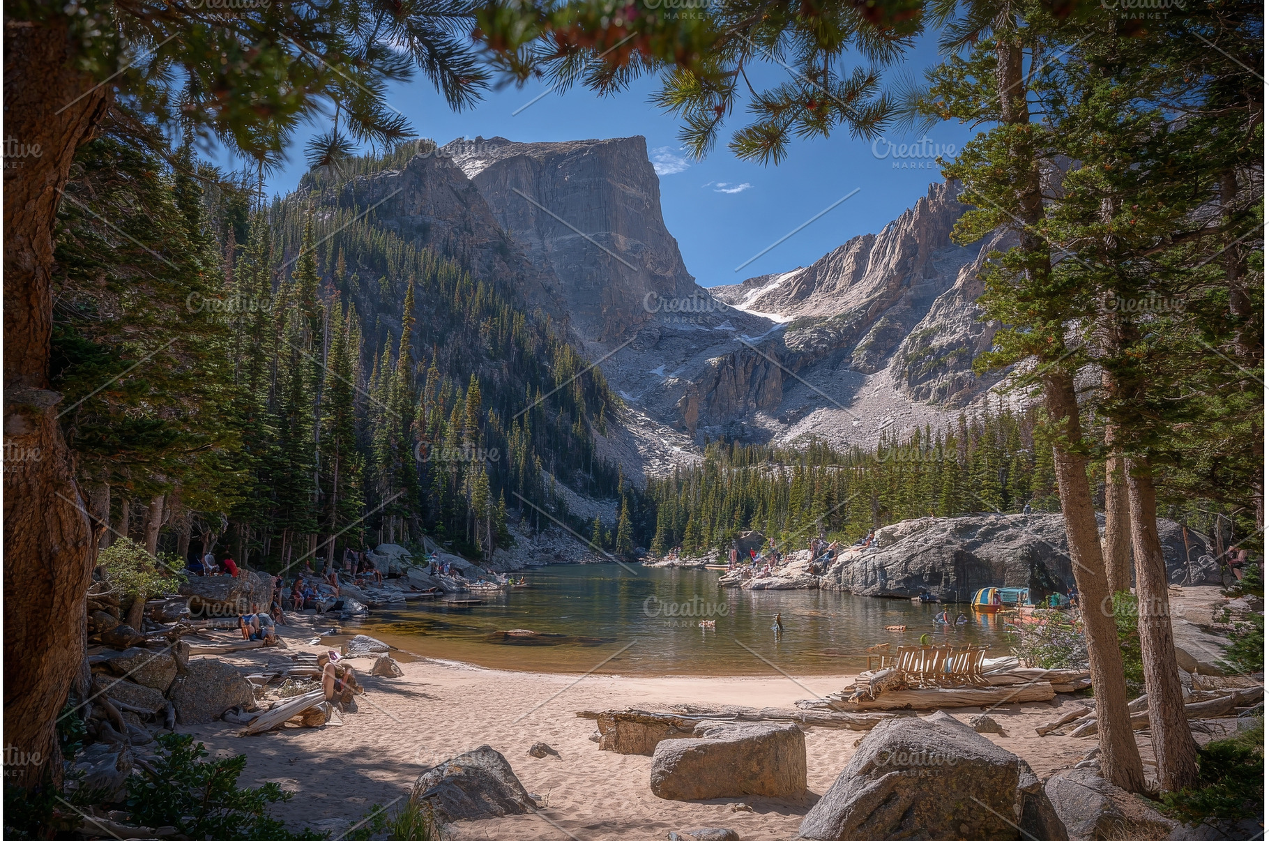 A woman hiking sits on the shores of, a Person Photo by ZinetroN