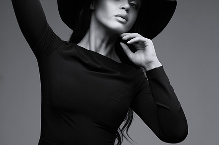 Elegant woman in long black dress stock photo containing black and white, a Beauty & Fashion Photo by MaxFrost