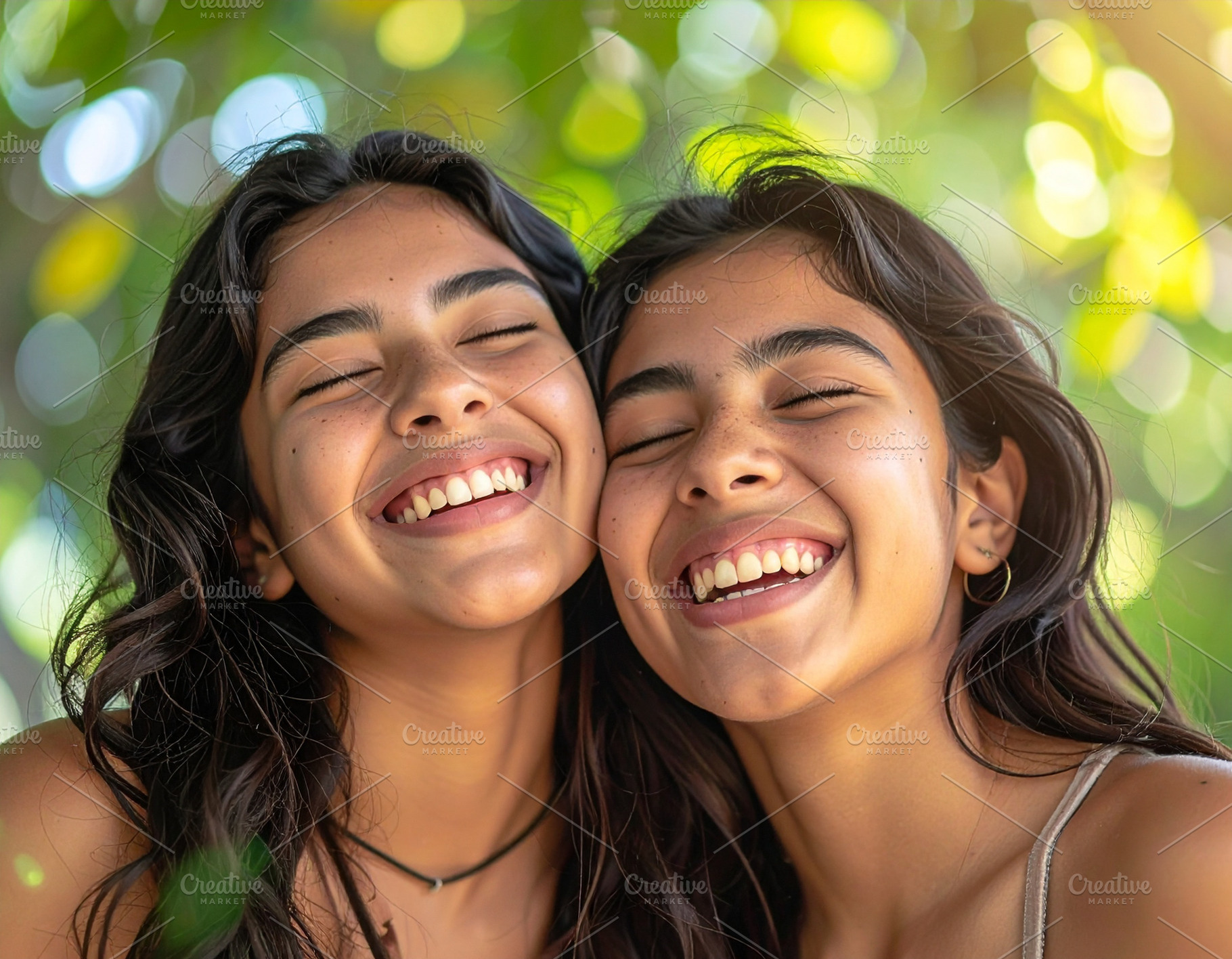 Two teenagers laughing with eyes closed closeup shot, a Person Photo by DanFLCreativo