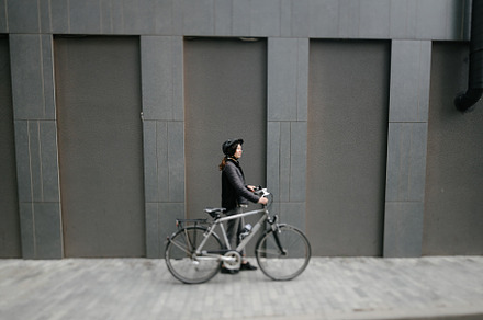 Woman riding a bicycle in a city