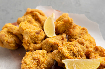 Homemade traditional japanese fried chicken Karaage on a rustic, a Food & Drink Photo by LiudmylaChuhunova