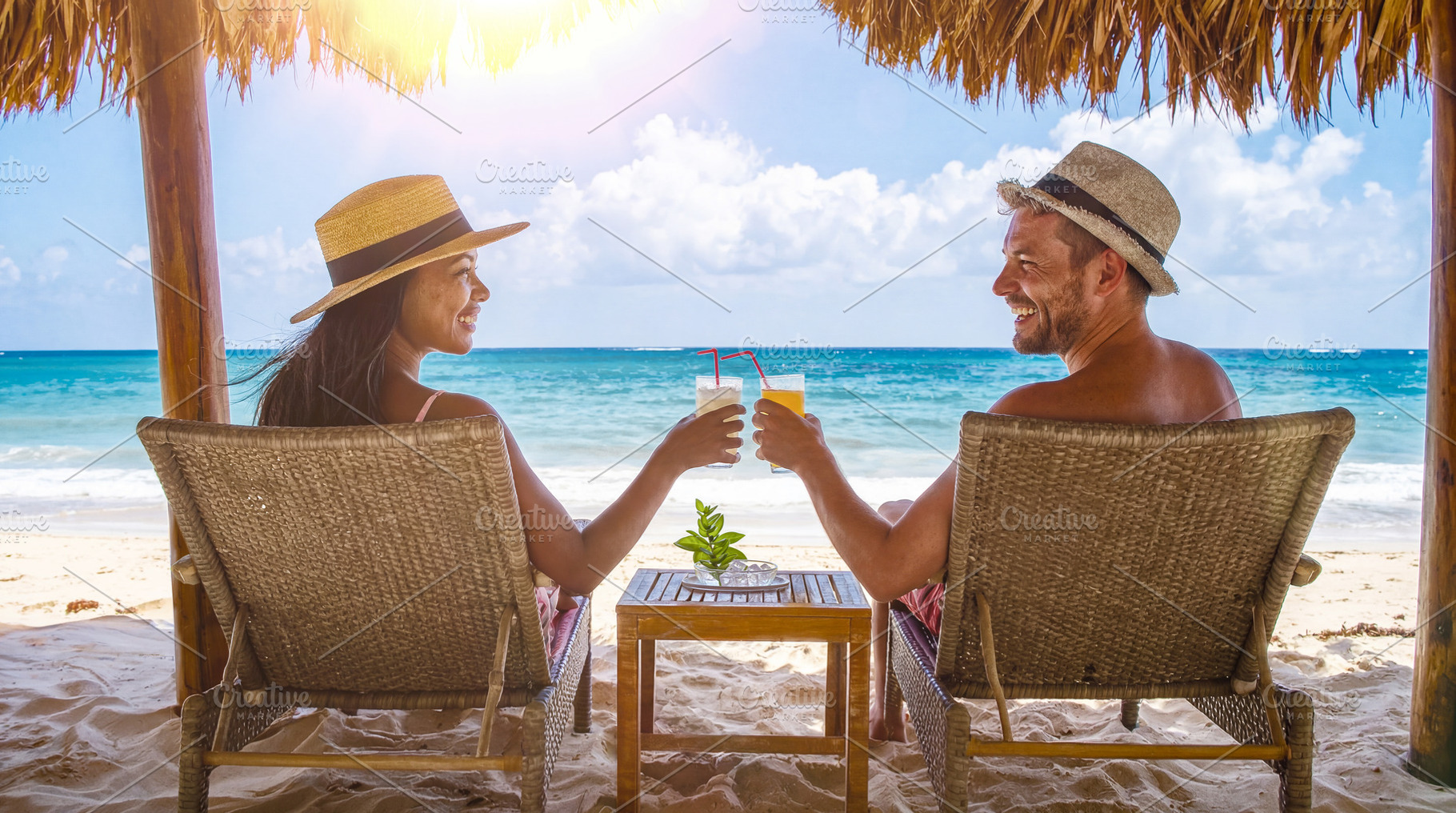 Couple Toasting Drinks on Tropical Beach, a Sports & Recreation Photo by Davizro's Market