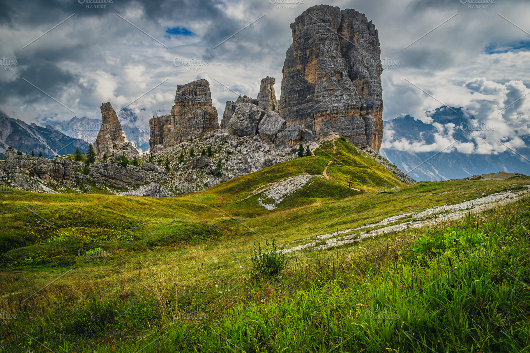 Green meadow and Cinque Torri rocks, a Nature Photo by Alpine Dreams