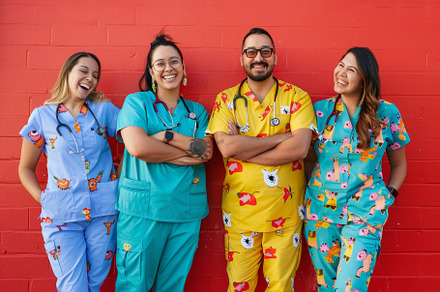 Cheerful staff in colorful scrubs st, a Photo by Iftikhar Alam