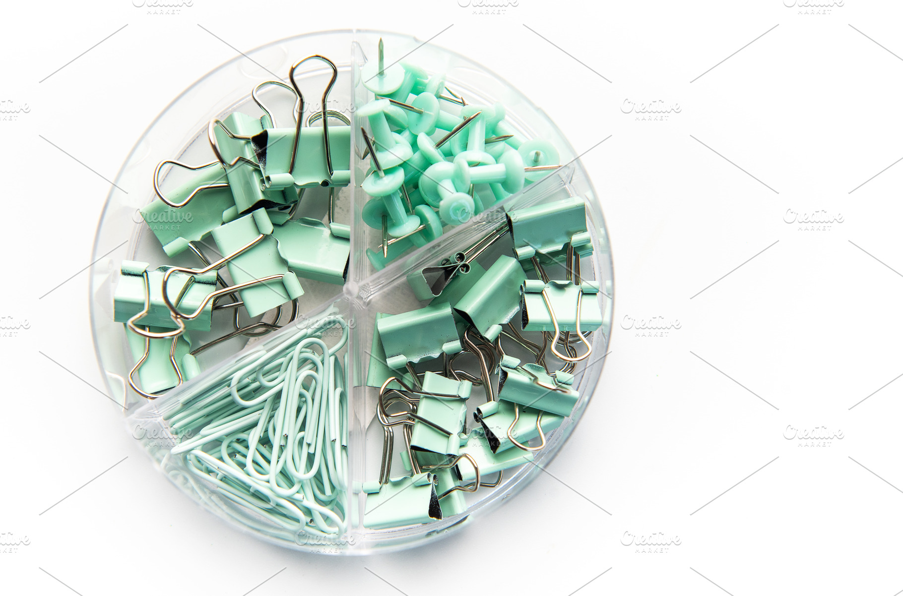 Mint green office supplies in clear organizer, a School & Education Photo by Olena Rudo
