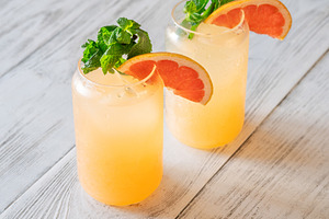 Two chilled Paloma cocktails, a Business Photo by Alexander Prokopenko