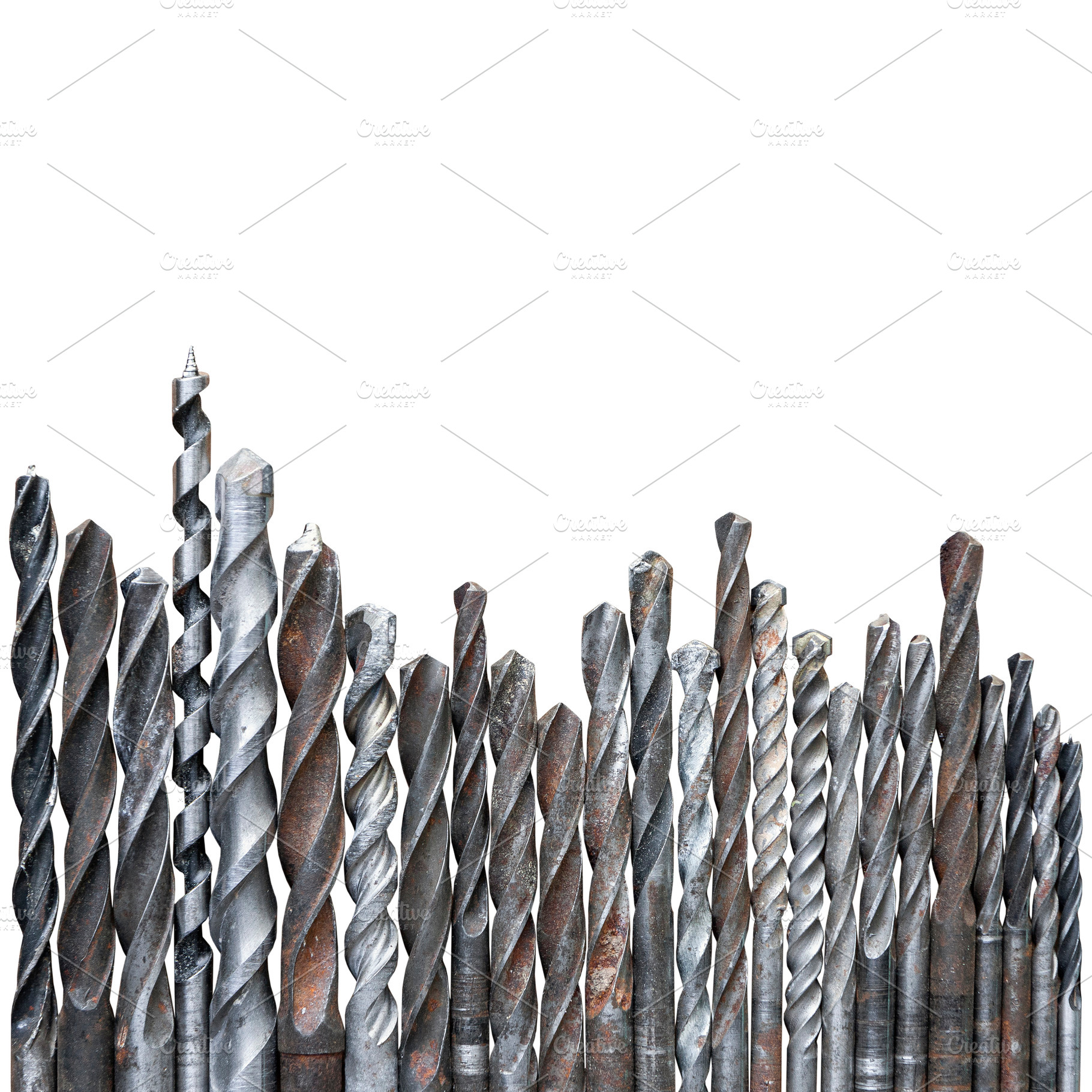 Old rusty drill bits isolated, an Industrial Photo by BOOCYS