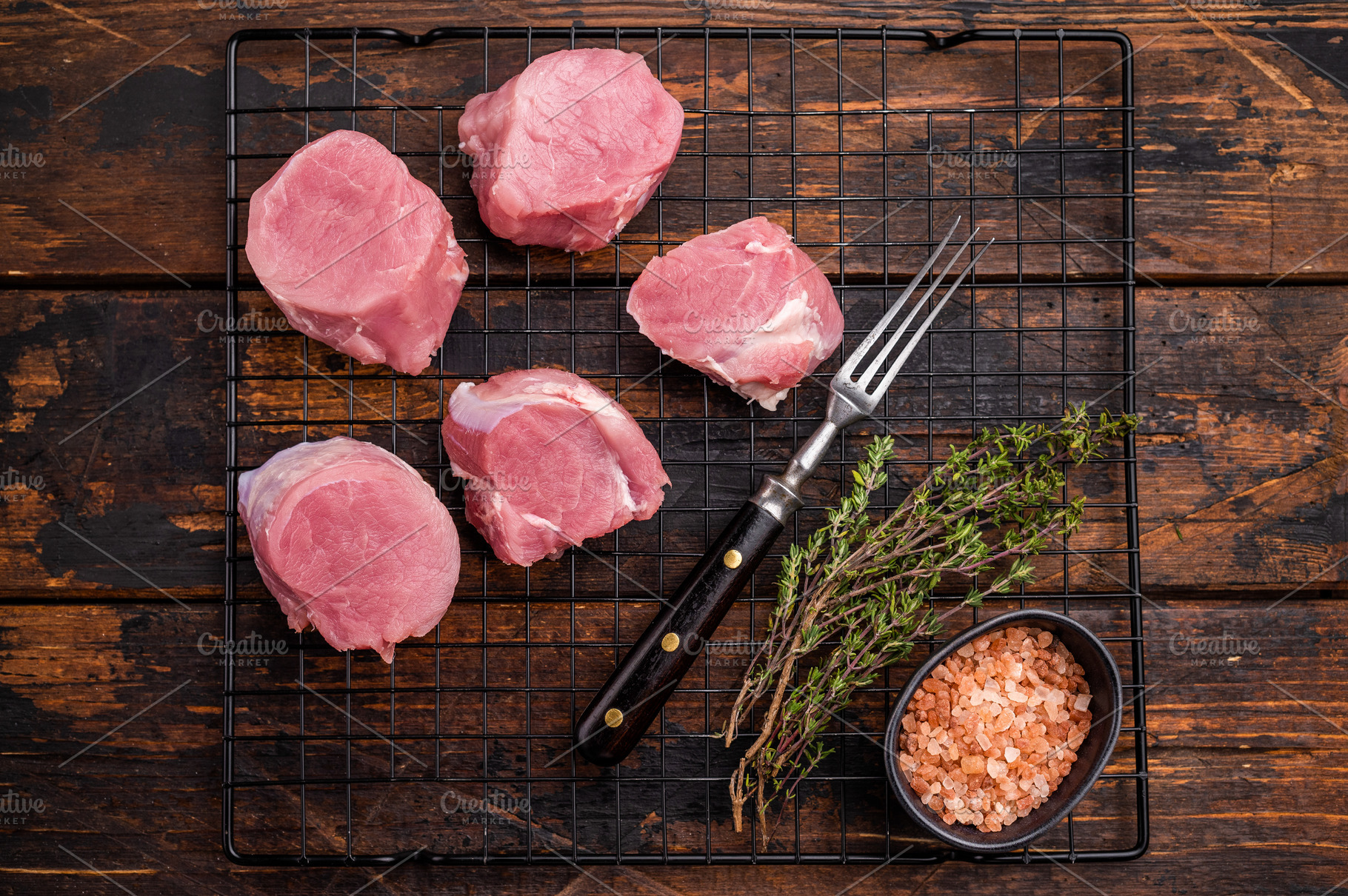 Uncooked pork loin medallion, cut tenderloin ready to be seasone, a Food & Drink Photo by composter-box@mail.ru