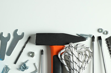 Work tools on white background, top view, an Industrial Photo by AtlasStudio PRO
