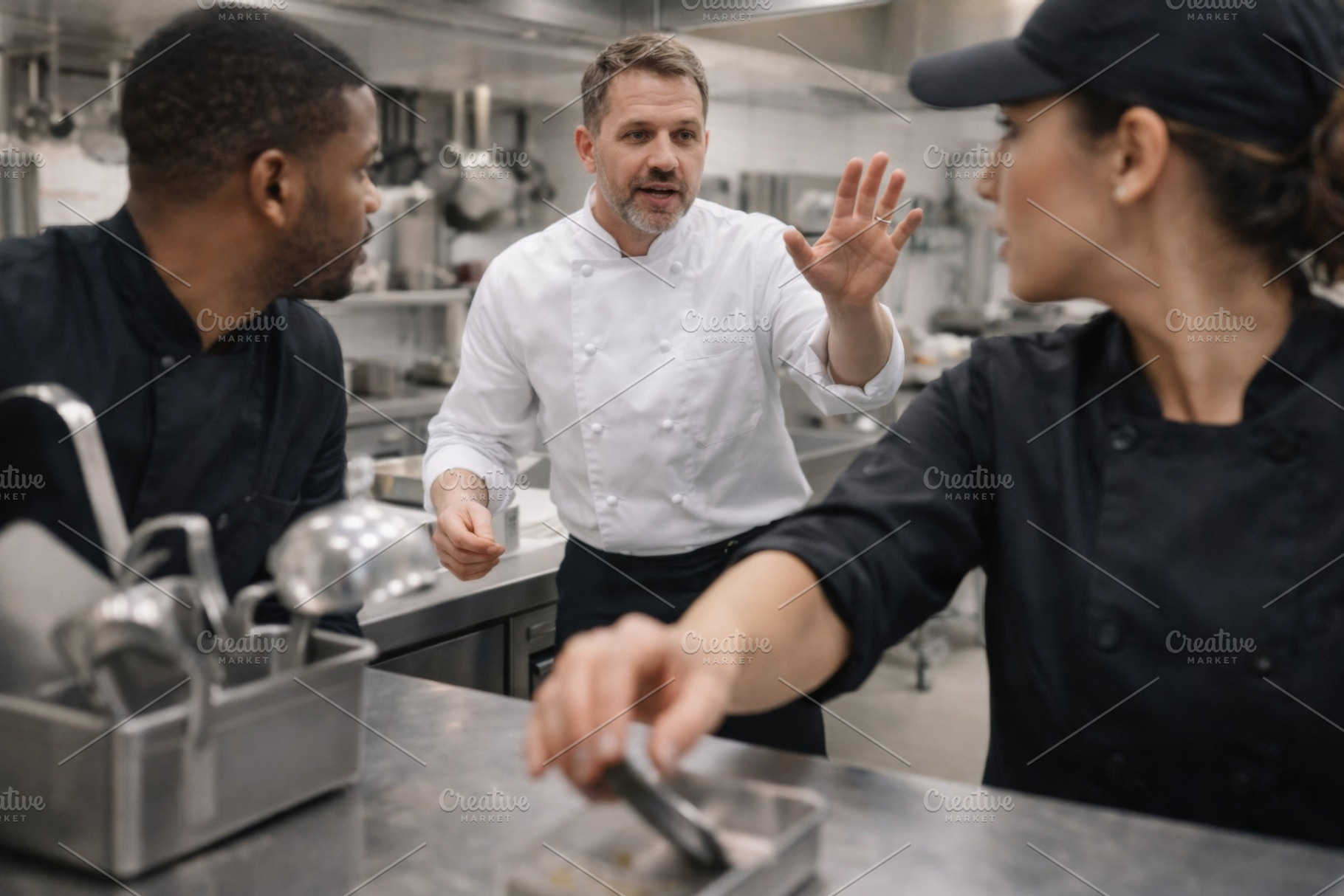 Professional chefs discussing kitche, a Photo by Dvoevnore photos