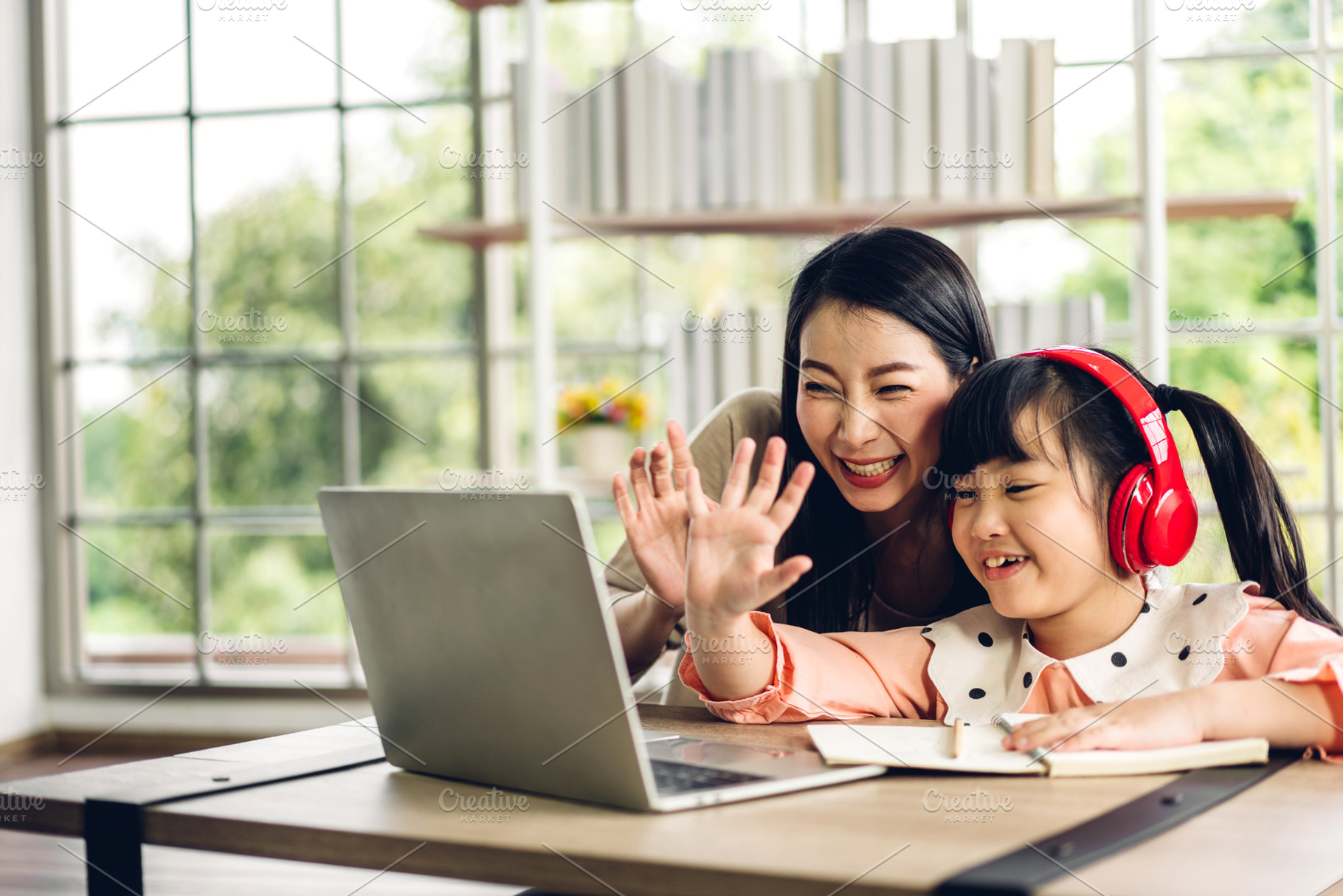 Mother and asian kid little girl learning and looking at laptop, a Person Photo by Art_Photo