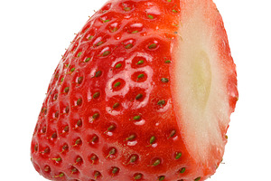 Close-up of a ripe red strawberry showing the texture of the ski, a Food & Drink Photo by ndanko