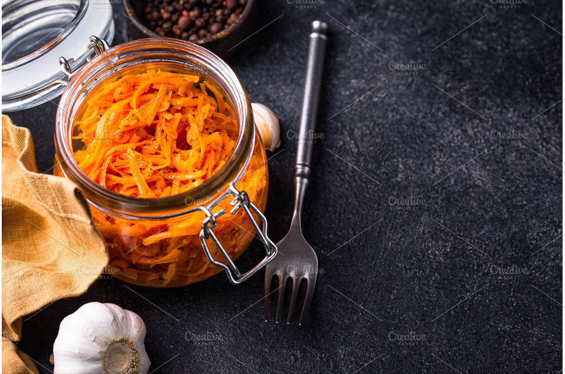 Spicy korean carrot salad in jar, a Food & Drink Photo by Yulia Furman