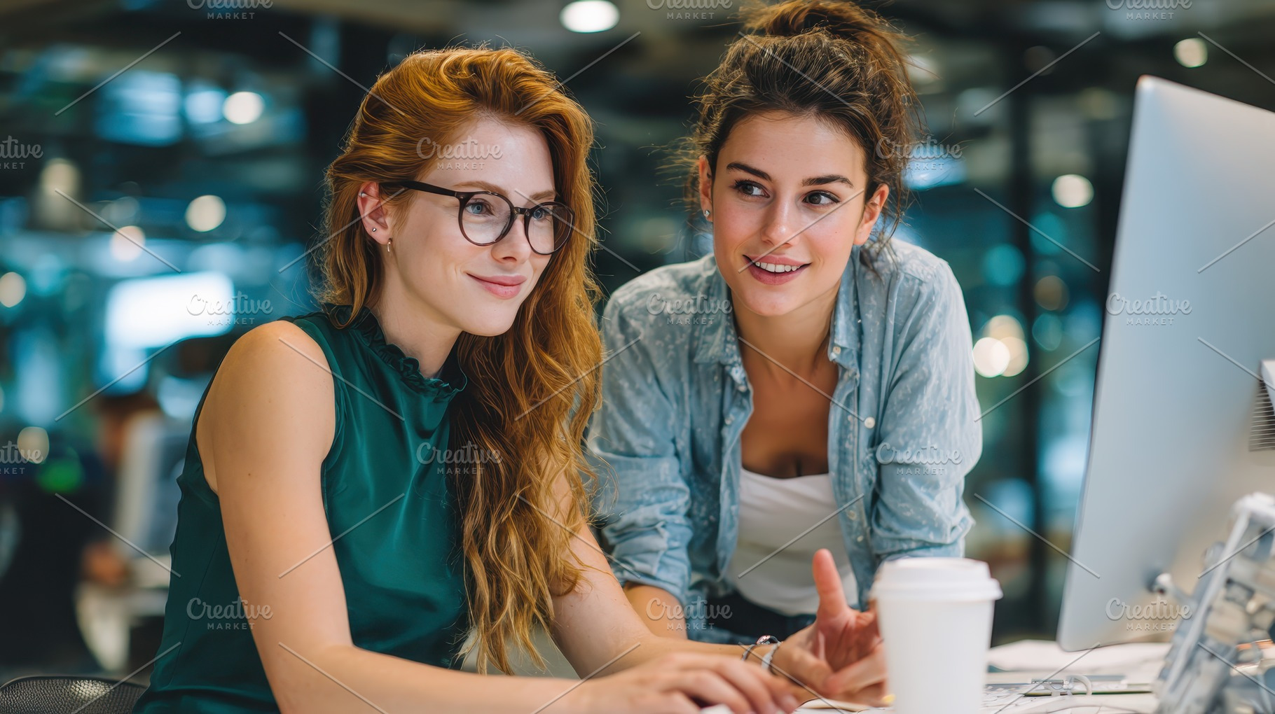 Two young women coworkers collaborat, a Photo by Pixeness Studio