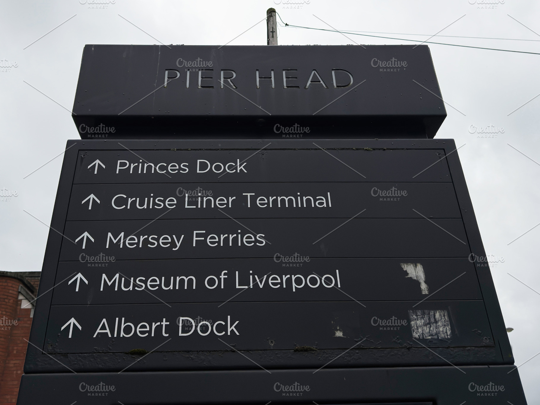 Pier Head directional sign at Liverpool waterfront pointing to P, a Photo by AS photostudio
