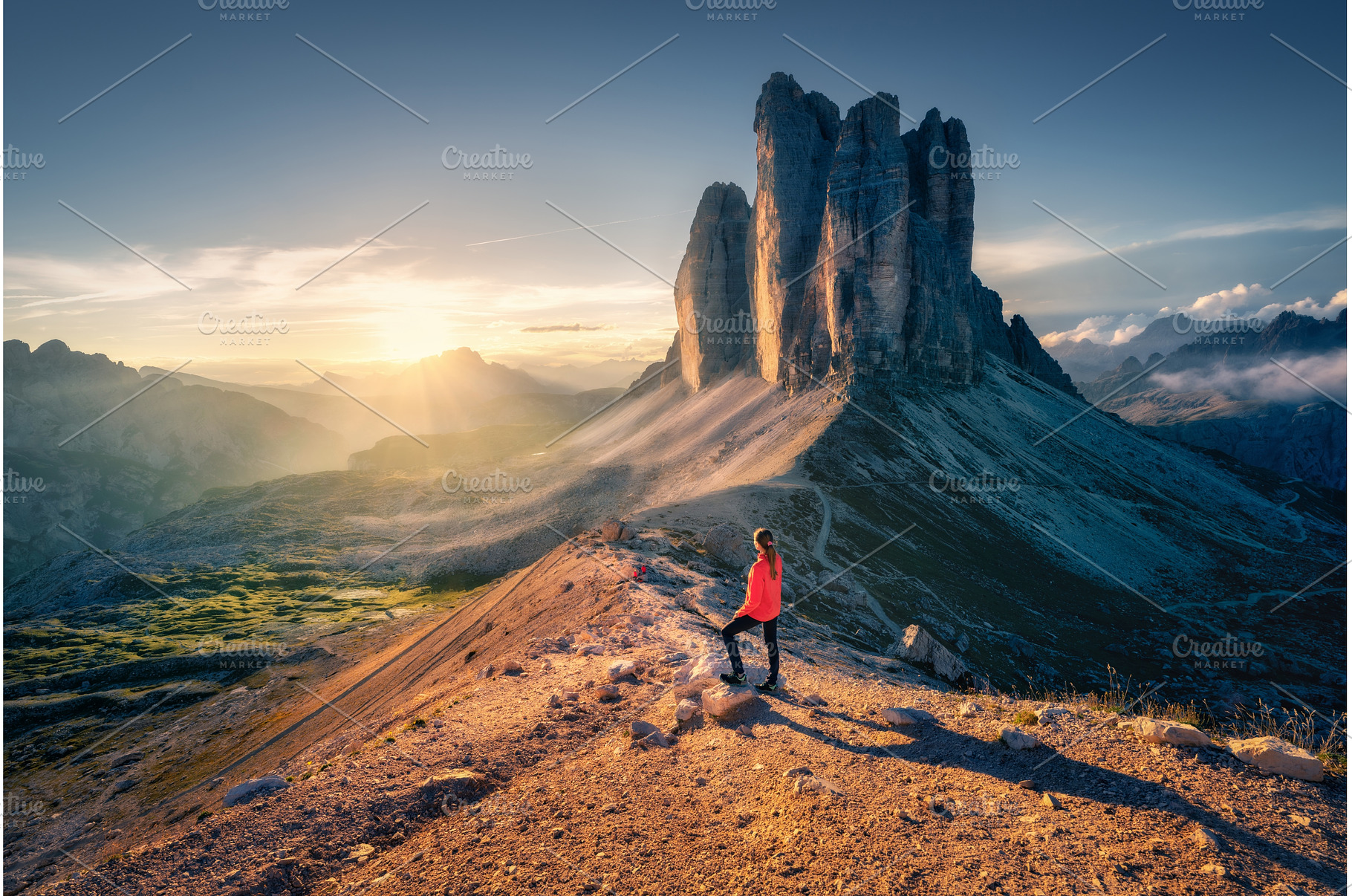 Hiker admiring Tre Cime di Lavaredo, a Person Photo by den-belitsky