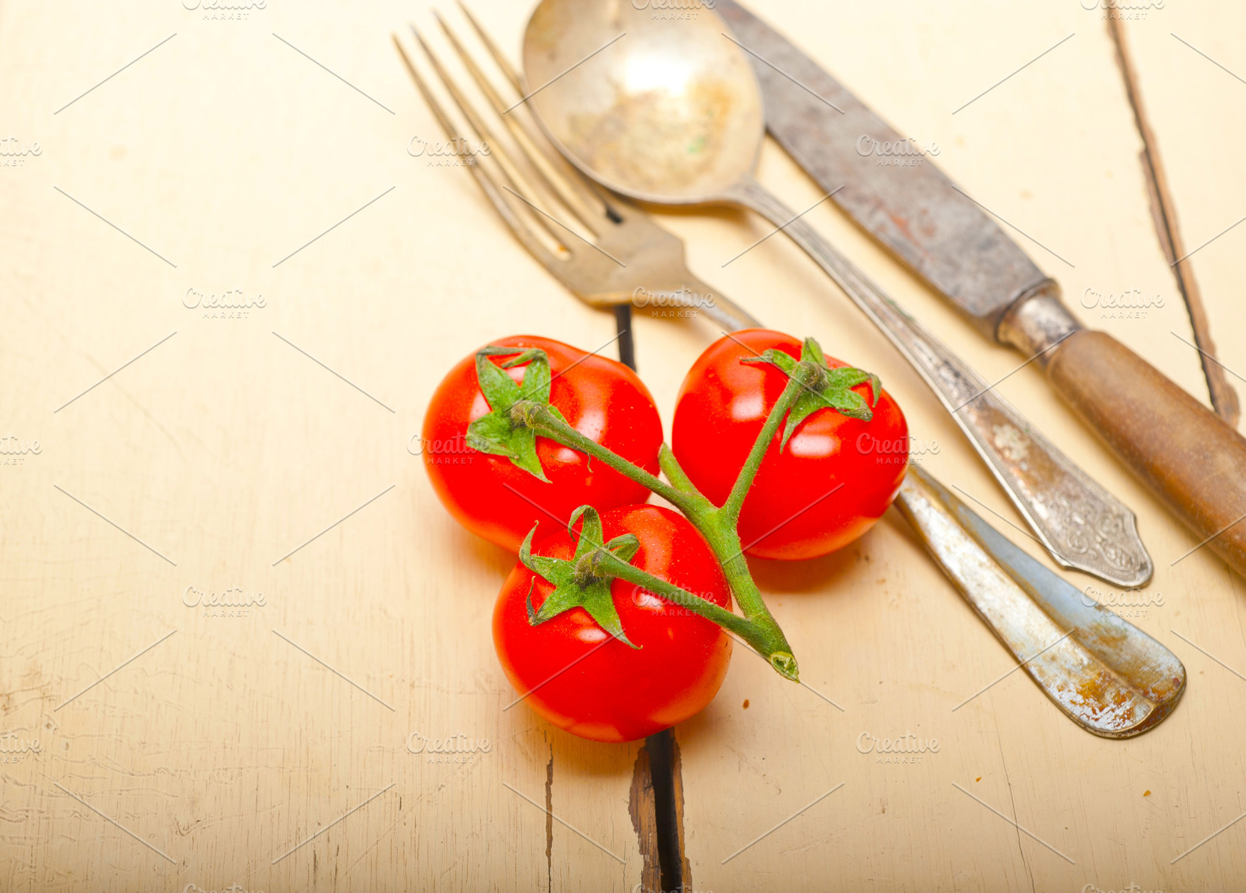 ripe cherry tomatoes over white wood, a Food & Drink Photo by keko64