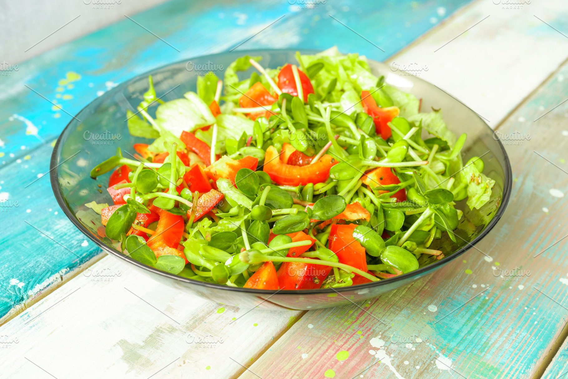 Fresh vegetable salad with micro greens and red pepper in a transparent bowl. C, a Food & Drink Photo by Eugene_Photo