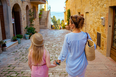 trendy mother and daughter in Tuscany, Italy sightseeing, a Person Photo by Alliance Images
