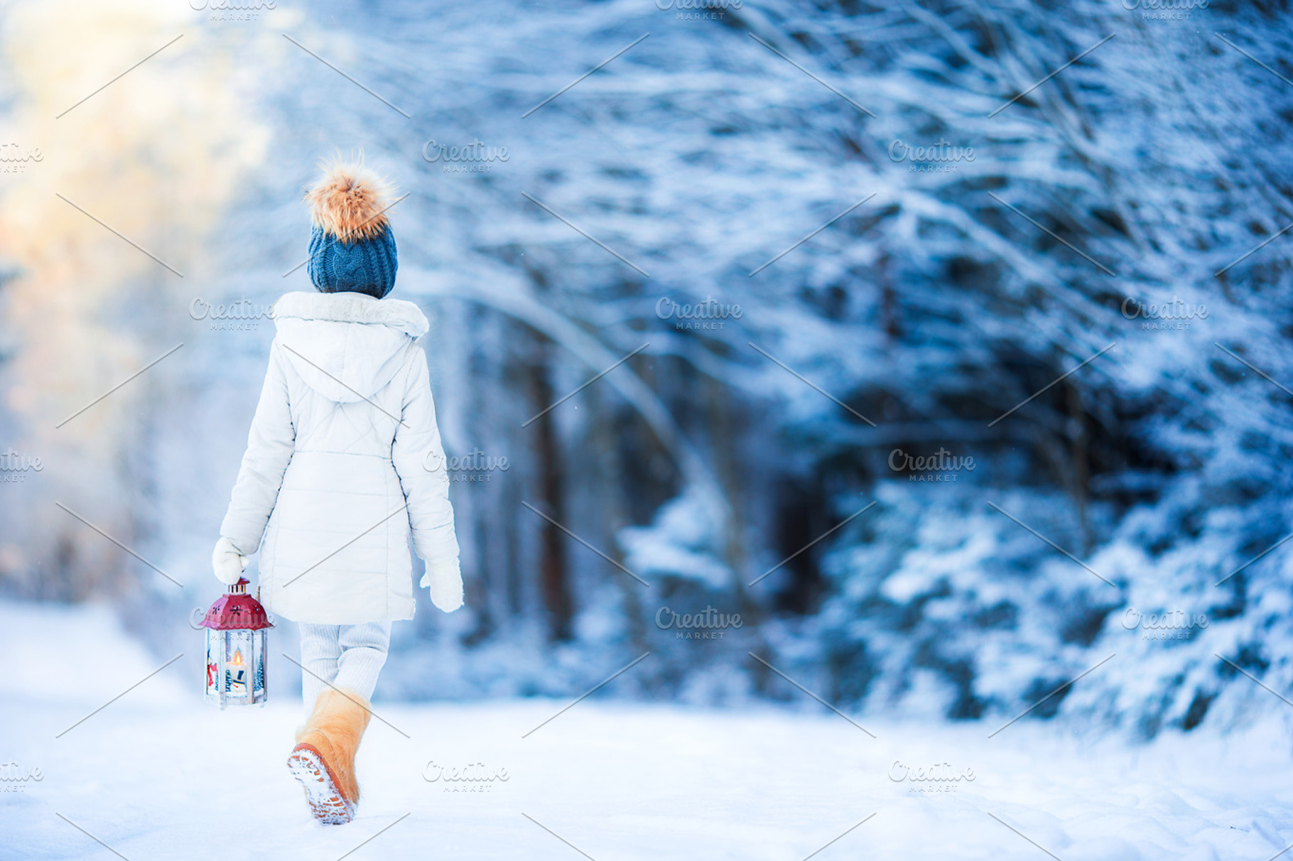 Adorable little girl with flashlight in winter on christmas outdoors stock, a Person Photo by travnikovstudio