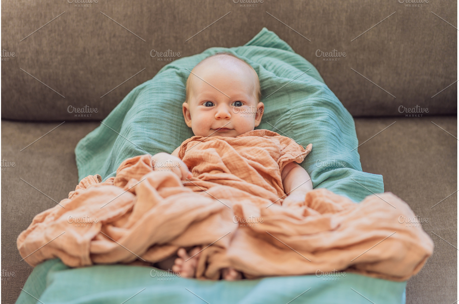 Newborn baby comfortably resting in, a Health & Medical Photo by Elizaveta Galitskaya