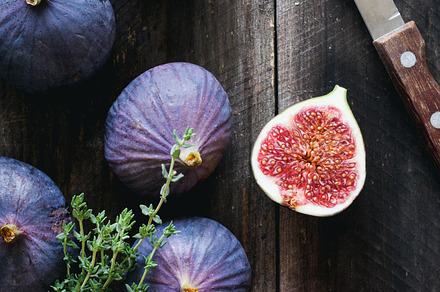 Purple figs, red apple and fresh thyme on wooden table, a Food & Drink Photo by The baking man