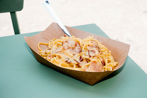 creamy spaghetti alla carbonara outdoors, a Photo by Nito