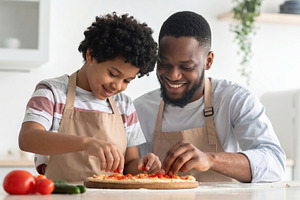 Father and Son Making Homemade Pizza, a Photo by Davizro's Market