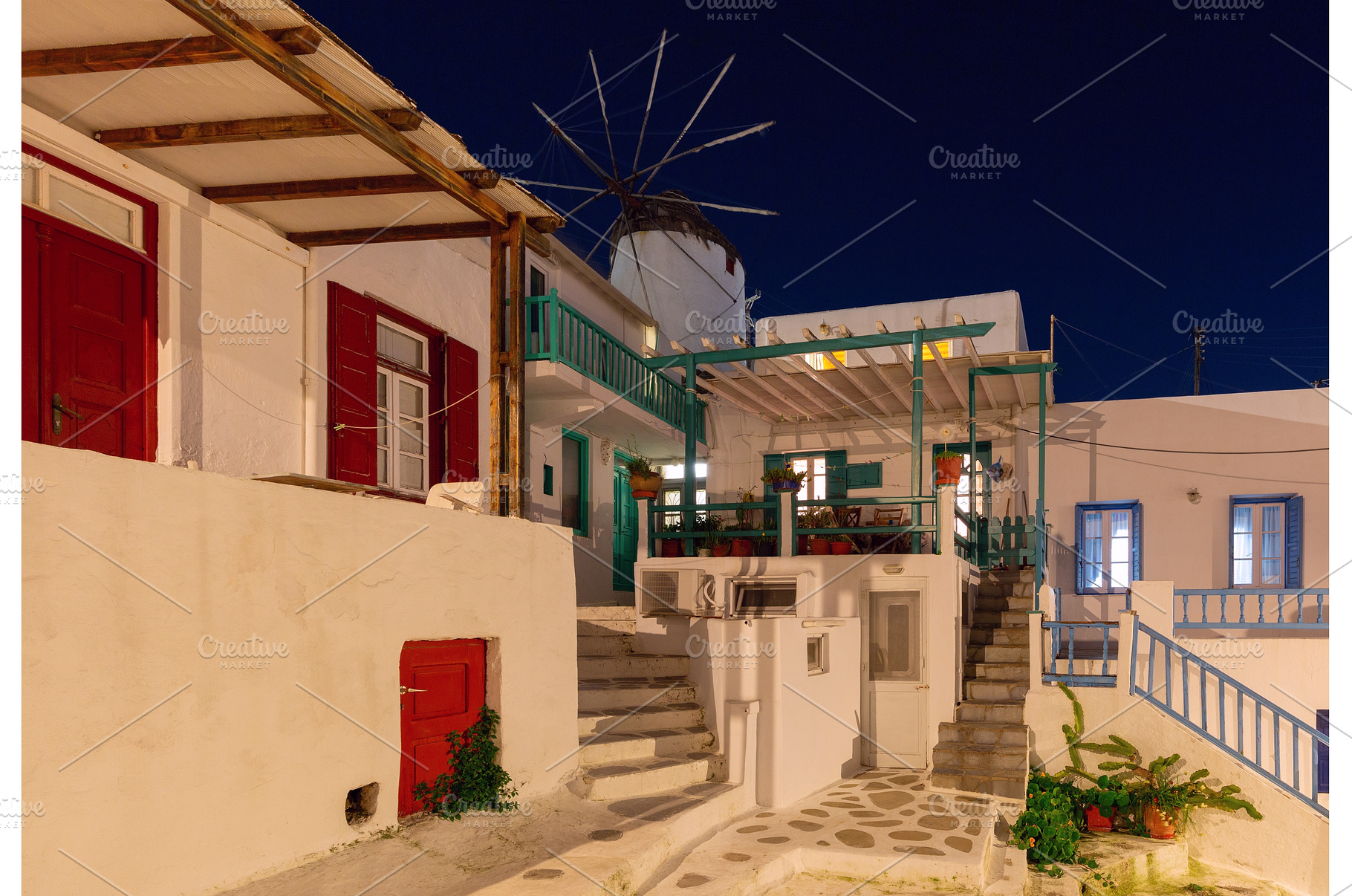 Traditional houses and windmill in, an Architecture Photo by kavalenkava