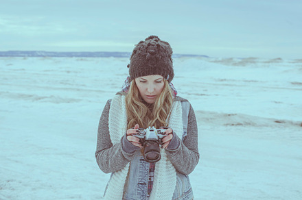 Woman with camera containing blonde hair, vintage camera, and beautiful