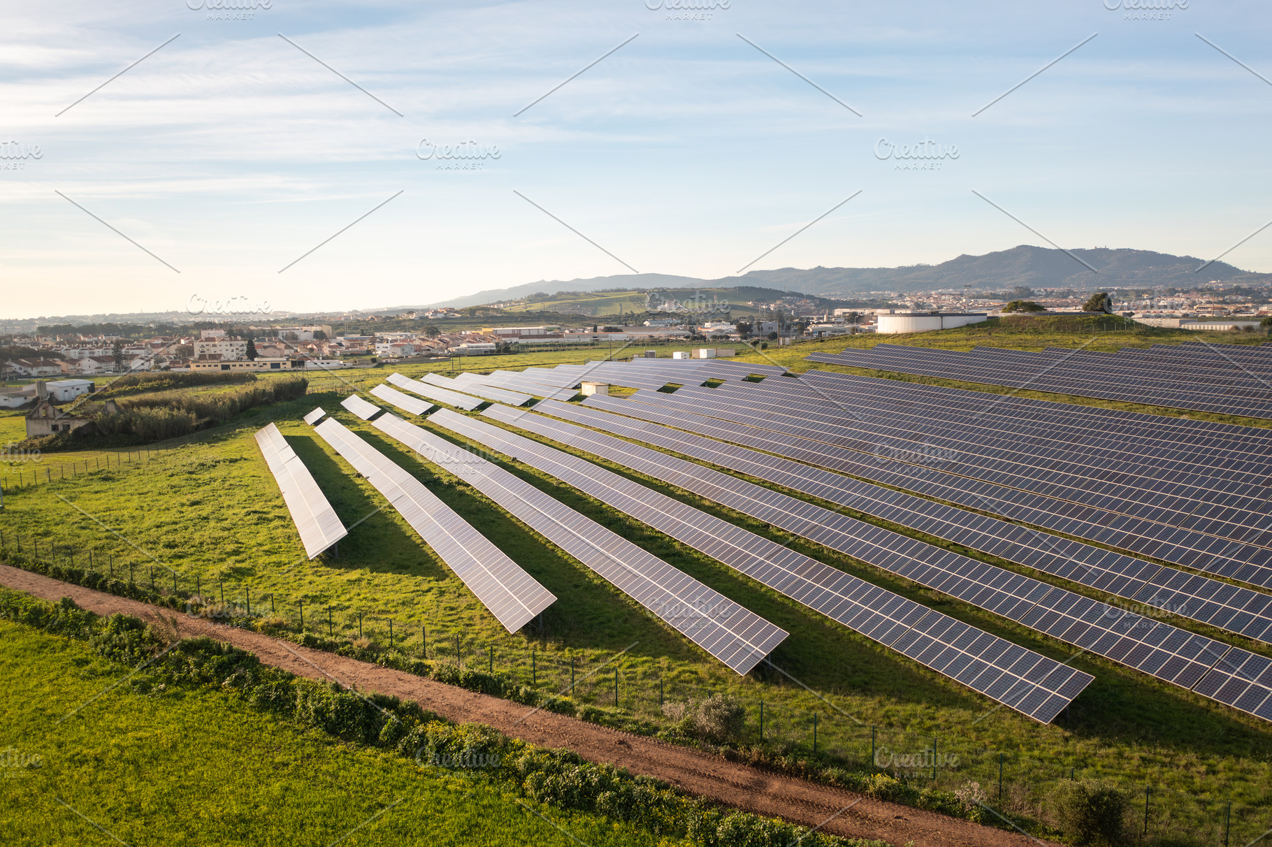 Drone shot of solar panels installed on agricultural land during day, a Photo by andreonegin market