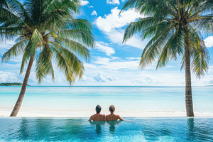 Couple enjoying a tropical beach, a Photo by Pavel_design