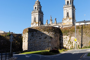 Lugo Cathedral rising behind the ancient Roman walls and defensive tower, an Architecture Photo by Bepslabor