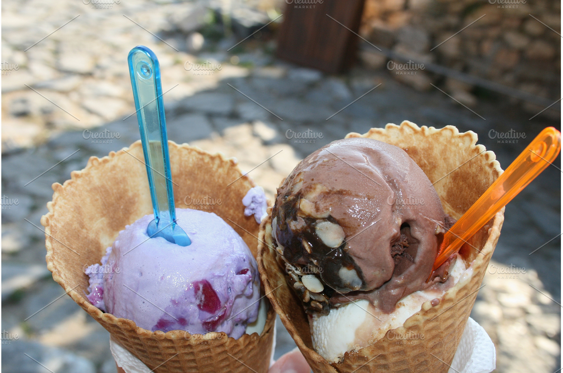 Two ice cream cones held outdoors on, a Food & Drink Photo by Lermont51