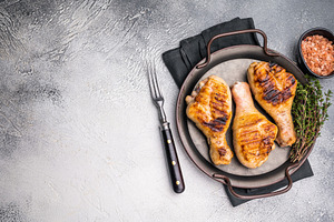 Juicy grilled chicken drumsticks, perfectly charred and bursting, a Food & Drink Photo by composter-box@mail.ru