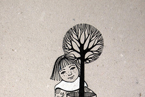 girl holding tree