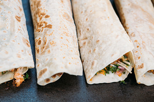 Tortilla roll burrito set traditional fast meal, a Food & Drink Photo by Photo Drive Studio