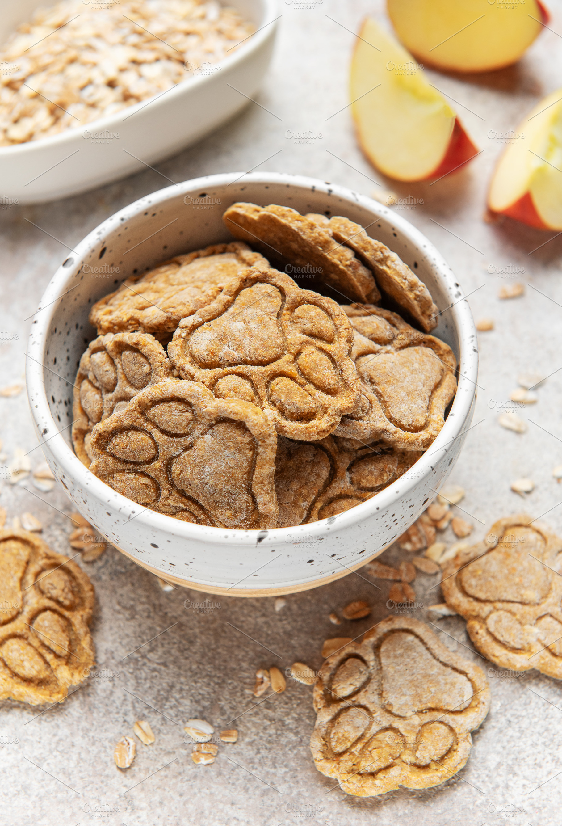 Homemade apple oat dog treats in speckled bowl, a Food & Drink Photo by Olena Rudo