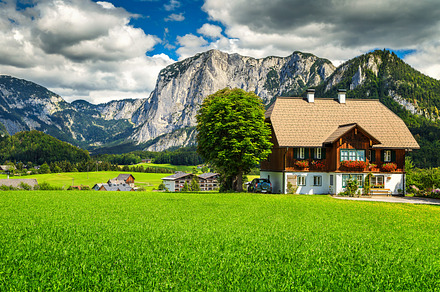 Alpine houses and mountains, Austria, a Nature Photo by Alpine Dreams