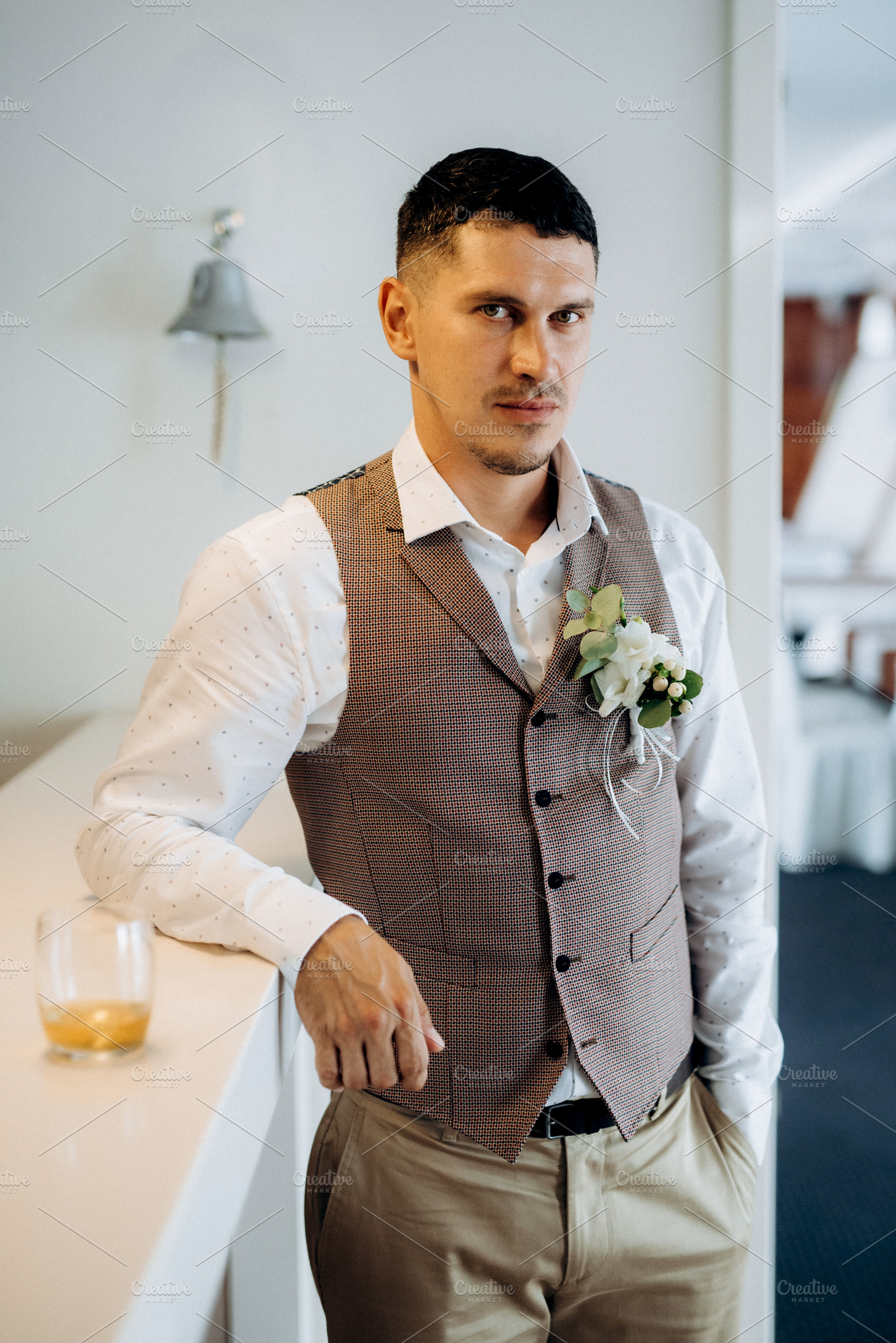 portrait of the groom in a gray suit and an orange vest, a Person Photo by Weddings, People, Travel