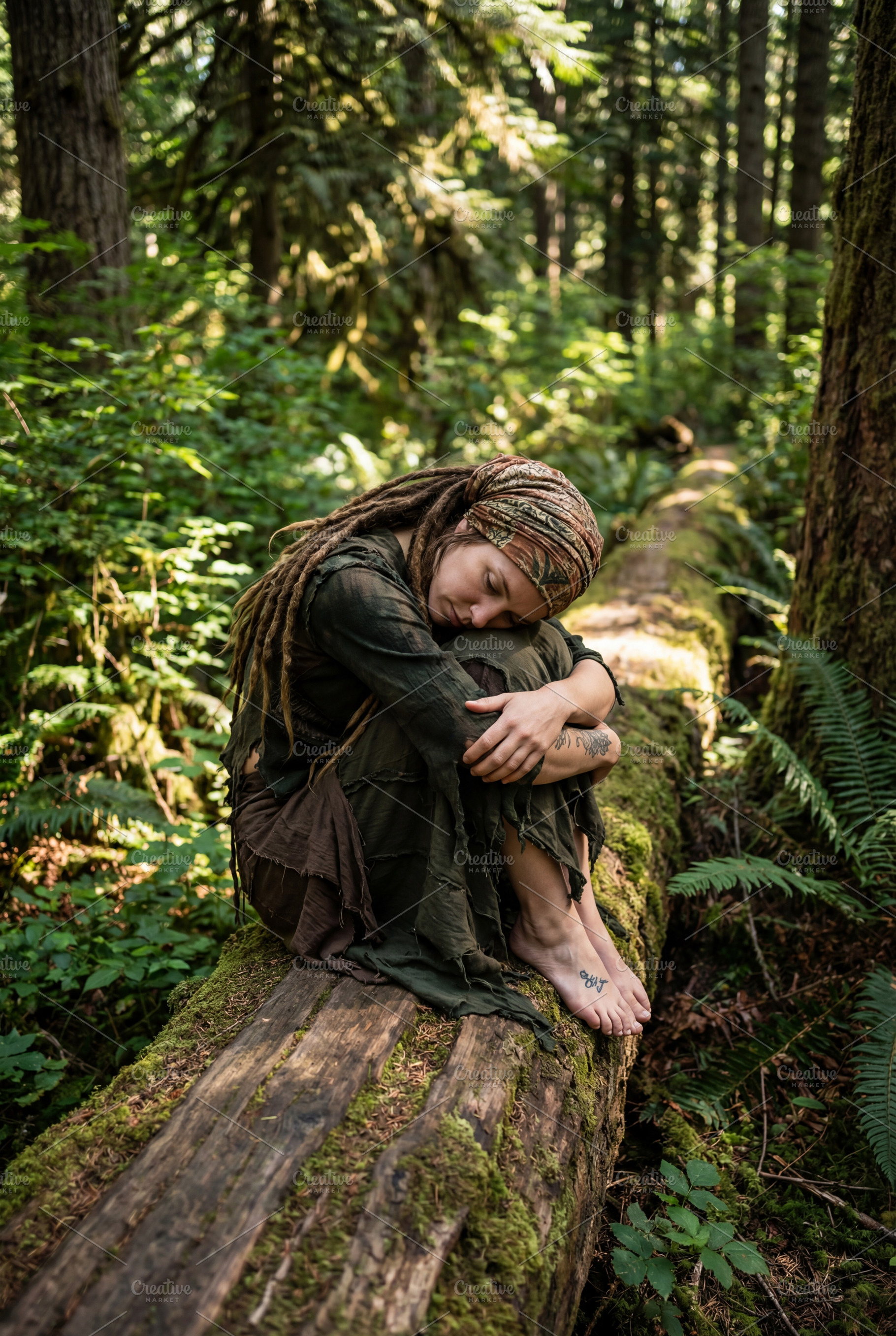 Bohemian Woman Resting on Mossy Log, a Person Photo by Virgo Studio
