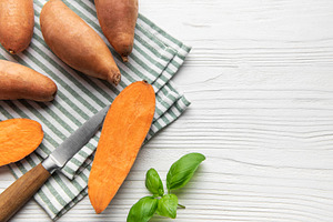 Sweet potato preparation with basil on striped napkin, a Food & Drink Photo by Olena Rudo