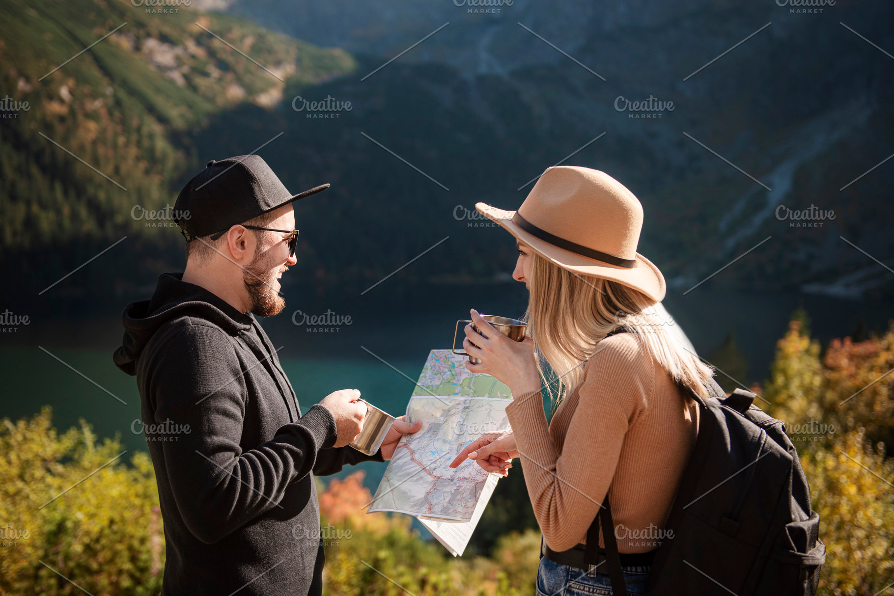 Young tourist couple, man and woman, on hiking path in mountains, a Person Photo by Olena Rudo