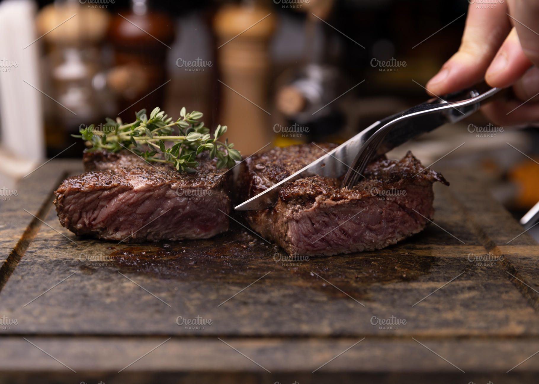 Steak on cutting board, garnished with fresh thyme, a Photo by Grafvision photography